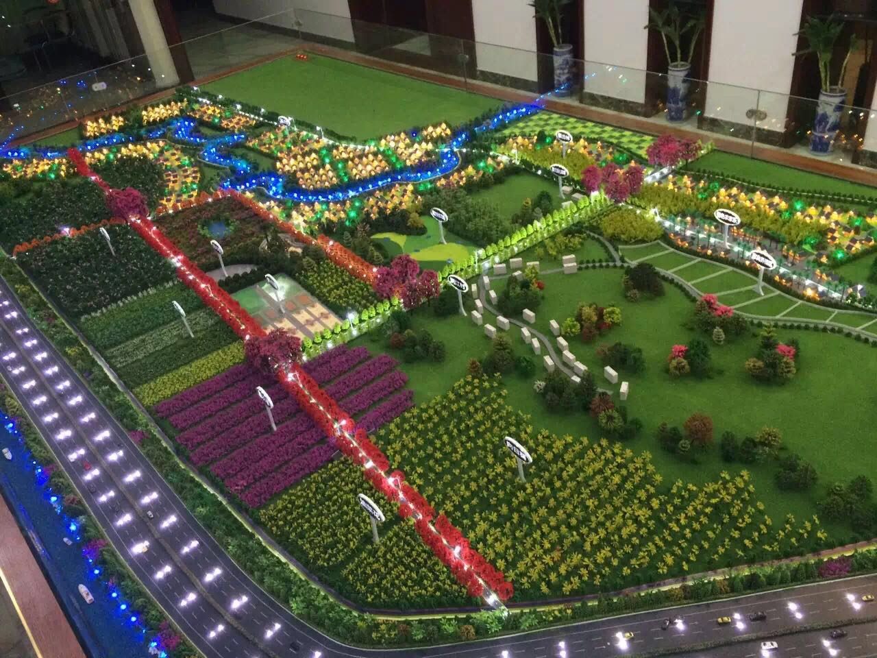 Landscape model with colour-coded lighting zones along pathways