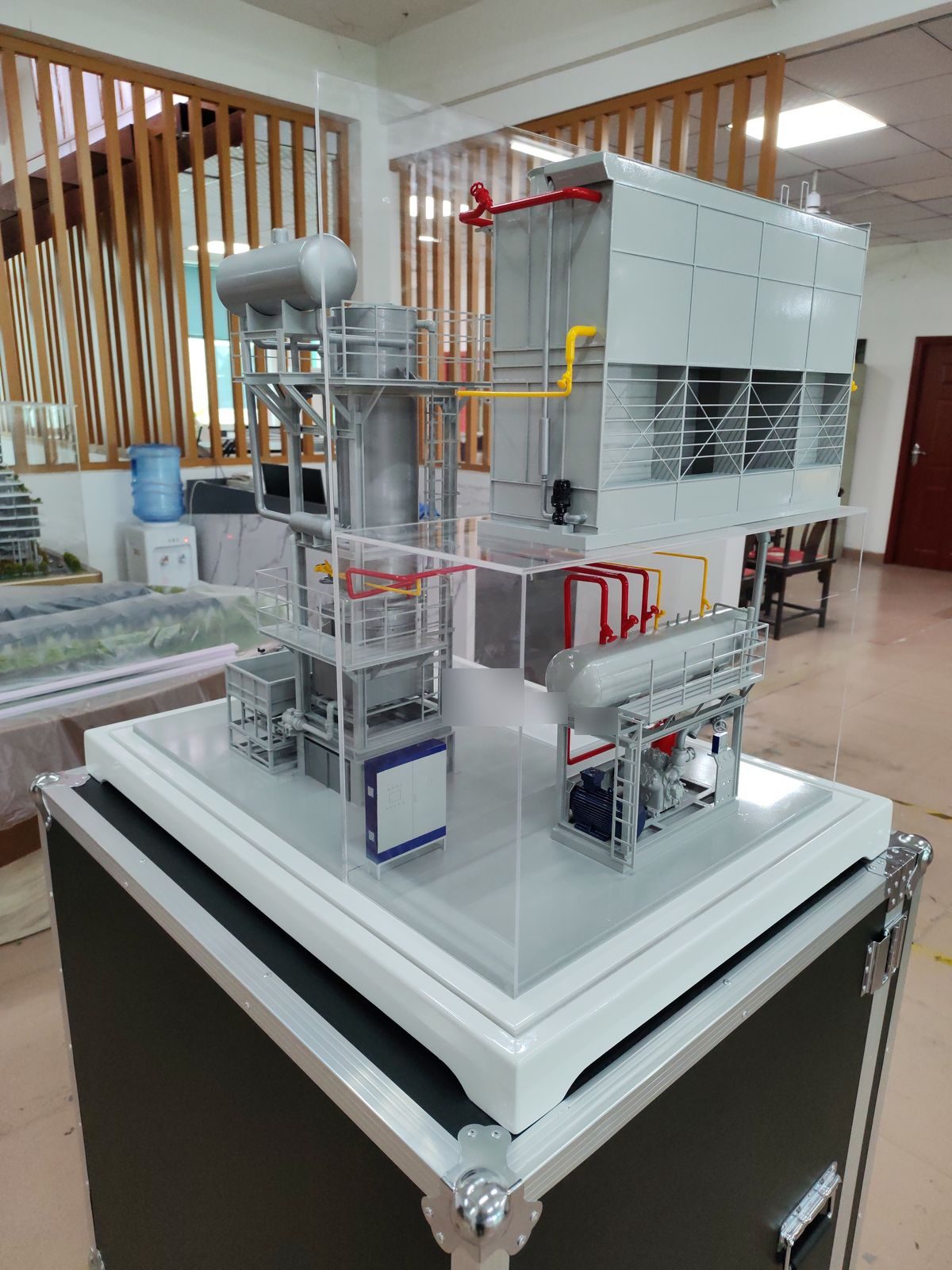 Vertical shot of an industrial equipment model with pipework